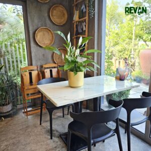 Healthy Peace Lily Spathiphyllum plant in a decorative yellow pot by Revan Flowers.